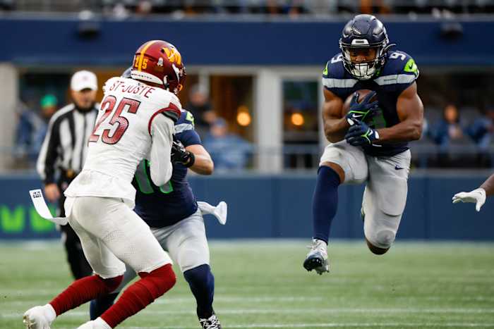 Seattle Seahawks running back Kenneth Walker III (9) rushes against the Washington Commanders during the second quarter at Lumen Field.